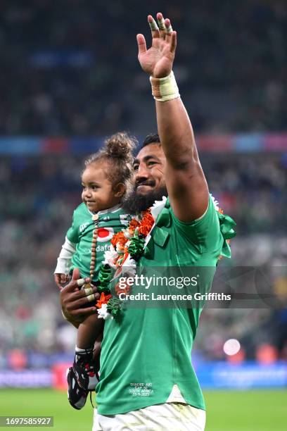 Bundee Aki of Ireland celebrates victory with a child after defeating South Africa during the Rugby World Cup France 2023 match between South Africa...