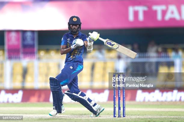 Dushan Hemantha of Sri Lanka plays a shot during the Bangladesh and Sri Lanka warm-up match prior to the ICC Men's Cricket World Cup at Assam Cricket...