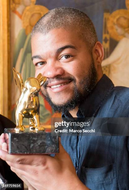 Edson Chagas of Angola, winner of the Golden Lion for Best National Participation, poses next to his award during the 55th International Art...