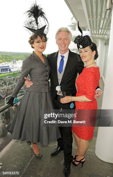 Martha Sitwell, Philip Treacy and Kim Murdoch attend Derby Day at the Investec Derby Festival at Epsom Racecourse on June 1, 2013 in Epsom, United...