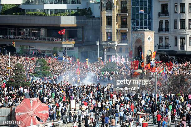 Protestors arrive in Taksim Square on June 1, 2013 after clashing with riot police during a protest against the demolition of Taksim Gezi Park in...