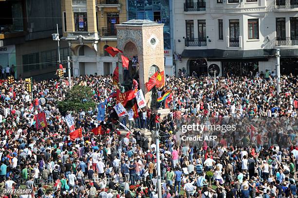 Turkish protestors arrive in Taksim square after a clashing with riot policemen on June 1 during a protest against the demolition of Taksim Gezi...