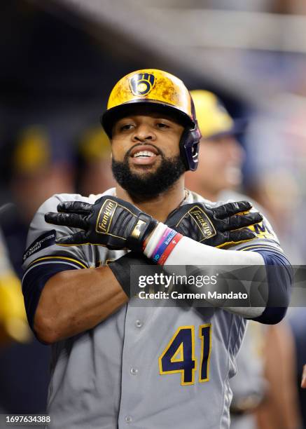 Carlos Santana of the Milwaukee Brewers celebrates hitting a three run home run during the sixth inning against the Miami Marlins at loanDepot park...