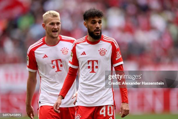 Matthijs de Ligt of FC Bayern München looks on with his team mate Noussair Mazraoui during the Bundesliga match between FC Bayern München and VfL...