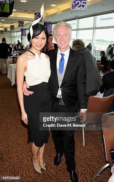 Gemma Chan, the face of this years Investec Derby Festival, and Philip Treacy attend Derby Day at the Investec Derby Festival at Epsom Racecourse on...