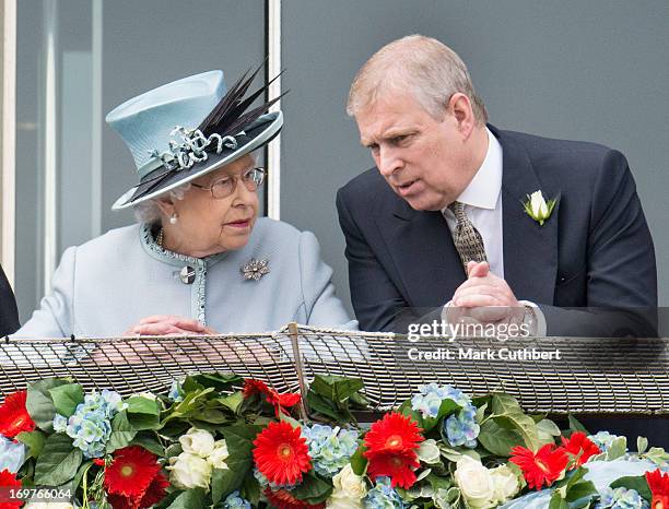 Queen Elizabeth II and Prince Andrew, Duke of York watch the racing at The Investec Derby Festival at Epsom Racecourse on June 1, 2013 in Epsom,...