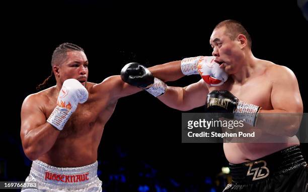 Joe Joyce punches Zhilei Zhang during the WBO Interim World Heavyweight Title fight between Zhilei Zhang and Joe Joyce at OVO Arena Wembley on...