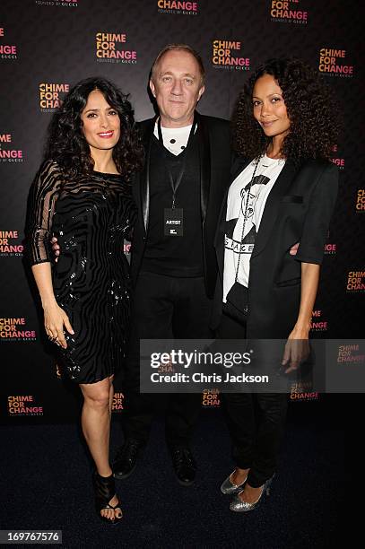 Salma Hayek Pinault, Francois Henri Pinault and Thandie Newton arrive at the Royal Box photo wall ahead of the "Chime For Change: The Sound Of Change...
