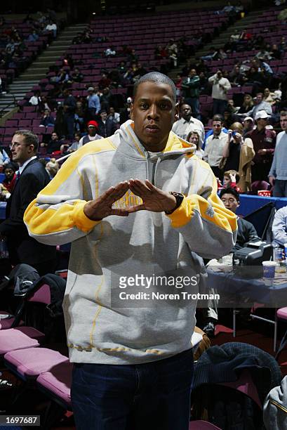 Rapper Jay-Z poses for a picture during the game between the Portland Trail Blazers and the New Jersey Nets at the Continental Airlines Arena on...