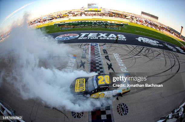 John Hunter Nemechek, driver of the Romco Equipment Toyota, celebrates with a burnout after winning the NASCAR Xfinity Series Andy's Frozen Custard...