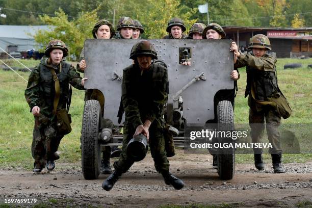 Members of youth military-patriotic clubs practice during a military-patriotic festival in the Tank Park in Saint Petersburg on September 2023.