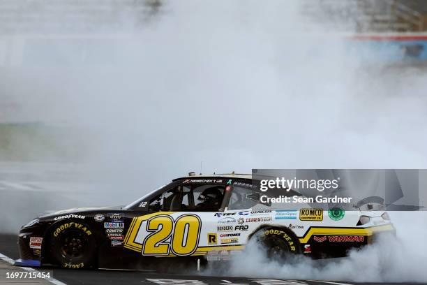 John Hunter Nemechek, driver of the Romco Equipment Toyota, celebrates with a burnout after winning the NASCAR Xfinity Series Andy's Frozen Custard...