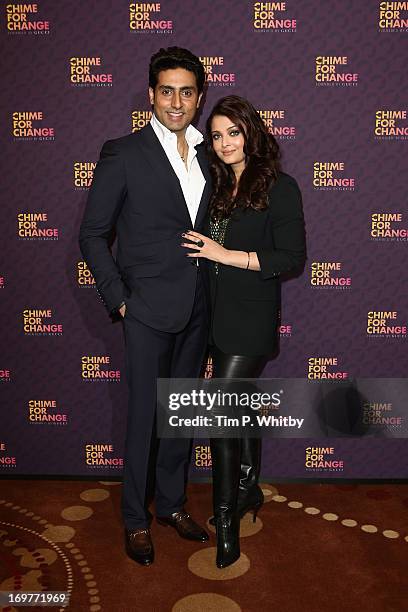 Abhishek Bachchan and Aishwarya Rai Bachchan pose backstage in the media room at the "Chime For Change: The Sound Of Change Live" Concert at...