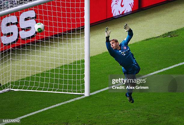 Manuel Neuer of Bayern Muenchen fails to stop Martin Harnik of VfB Stuttgart scoring their first goal with a header during the DFB Cup Final match...