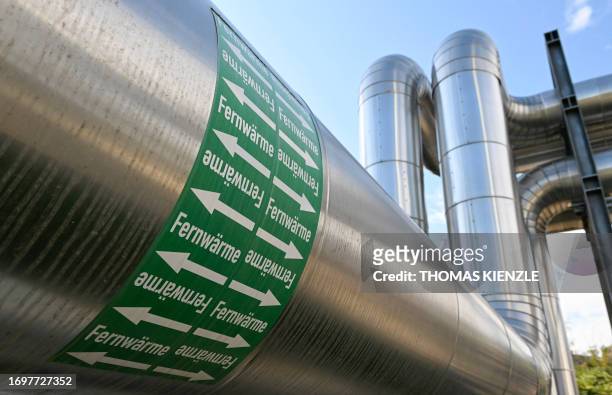 Pipes are labeled with the word "Fernwaerme" at the district heating plant Stuttgart-Gaisburg of power company EnBW in Stuttgart, southern Germany,...