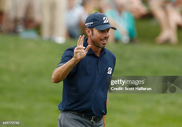 Matt Kuchar celebrates his birdie putt on the 14th hole during the third round of the Memorial Tournament presented by Nationwide Insurance at...