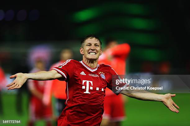 Bastian Schweinsteiger of Bayern Muenchen celebrates victory after the DFB Cup Final match between FC Bayern Muenchen and VfB Stuttgart at...