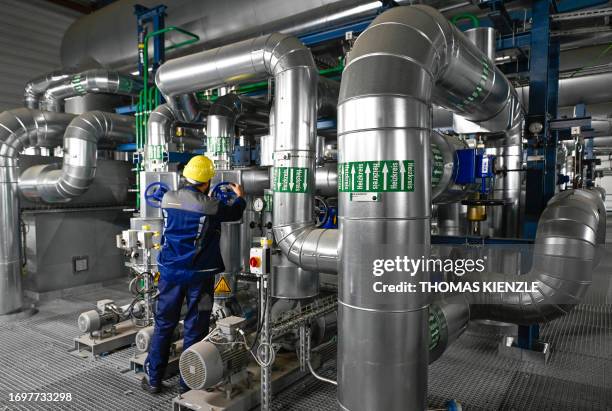 An employee of the power company EnBW inspects facilities at the district heating plant Stuttgart-Gaisburg in Stuttgart, southern Germany, on...