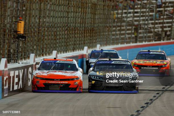 Parker Kligerman, driver of the Spiked Light Coolers Chevrolet, John Hunter Nemechek, driver of the Romco Equipment Toyota, Austin Hill, driver of...