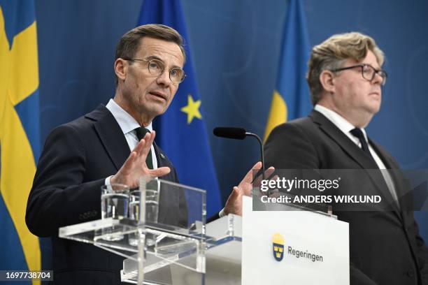 Sweden's Prime Minister Ulf Kristersson and Minister of Justice Gunnar Strömmer give a press conference after talks about the latest increase of gang...