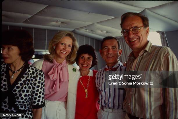 Portrait of married couple, journalist Anna Murdoch & businessman Rupert Murdoch , as they pose on either side of fellow couple, Susan Newhouse &...