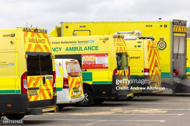 Ambulances and emergency incident vehicles in the car park as South East Coast Ambulance Service organised simulated emergency situation on Camber...