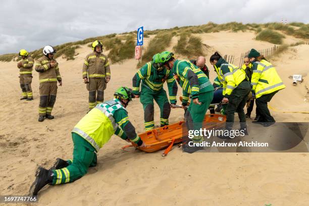 Staff and volunteers from South East Coast Ambulance Service taking part in an organised simulated emergency situation on Camber Sands on the 28th of...