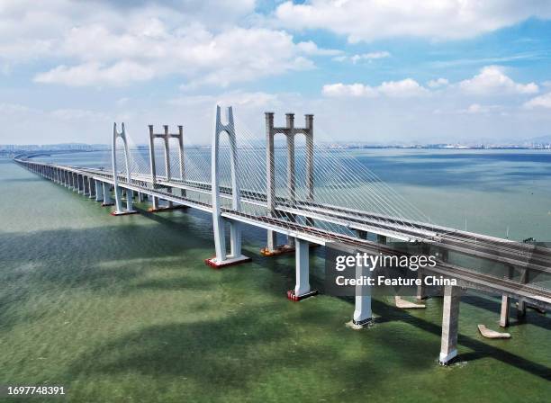 Bullet train runs across Quanzhou Bay Bridge on the first day of operation of the 350km/h Fuzhou-Xiamen highspeed railway in Quanzhou in southeast...