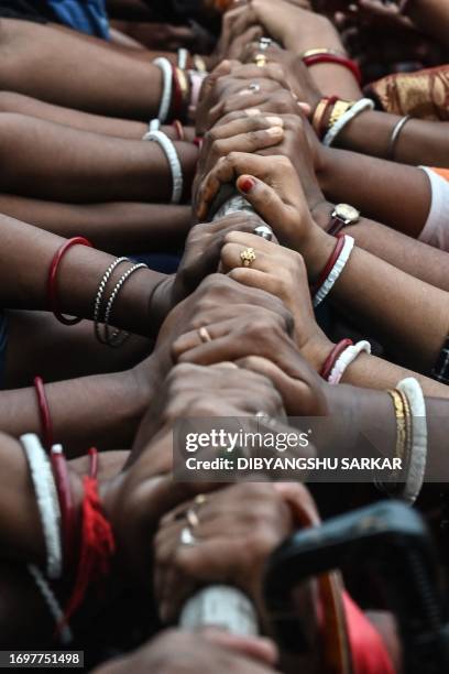 Activists of the women wing of the Bharatiya Janata Party scuffle with police during a protest against the authorities' failure to control the recent...