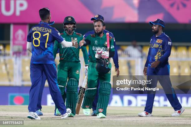 Mushfiqur Rahim and Mehidy Hasan Miraz of Bangladesh celebrate their victory during the Bangladesh and Sri Lanka warm-up match prior to the ICC Men's...