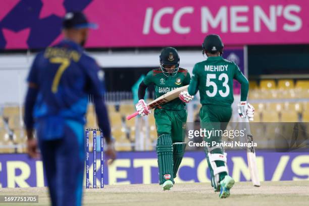 Mushfiqur Rahim and Mehidy Hasan Miraz of Bangladesh take the winning run during the Bangladesh and Sri Lanka warm-up match prior to the ICC Men's...