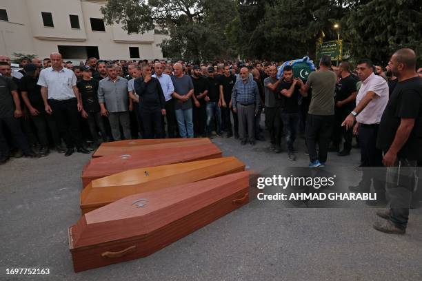 Mourners attend the funeral of five Arab Israelis who were shot dead in the town of Basmat Tabun, in northern Israel on September 29, 2023. Three men...