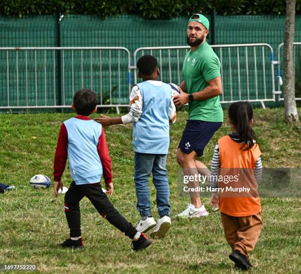 Tours , France - 29 September 2023; Jamison Gibson-Park with children during an Ireland rugby visit to Drop Quartier Rugby ran by UST Tour Rugby in...