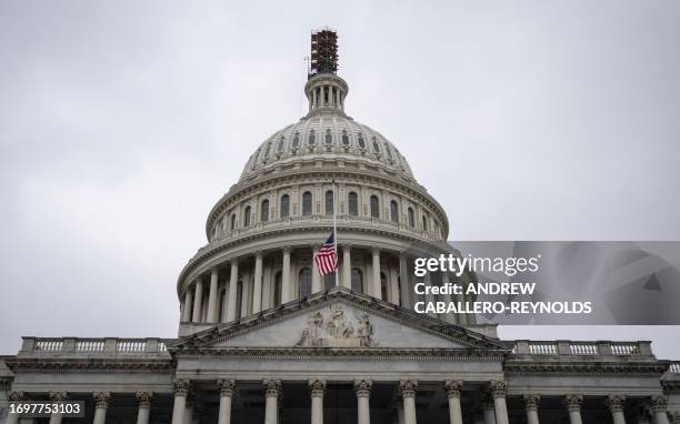 The US flag flies at half staff after the death of US Senator Dianne Feinstein, Democrat of California, at the US Capitol in Washington, DC on...