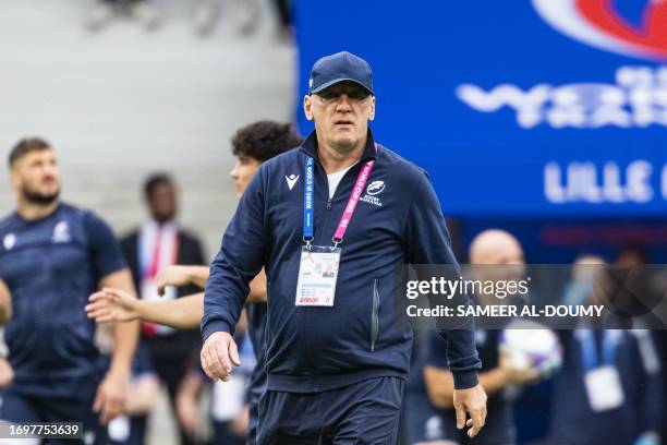 Romania's head coach Eugen Apjok takes part in the captain's run training session at Pierre-Mauroy stadium in Villeneuve-d'Ascq near Lille, northern...