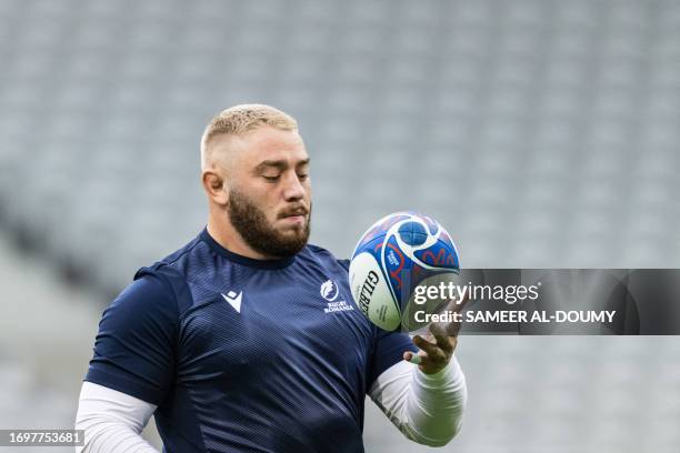 Romania's prop Iulian Hartig takes part in the captain's run training session at Pierre-Mauroy stadium in Villeneuve-d'Ascq near Lille, northern...