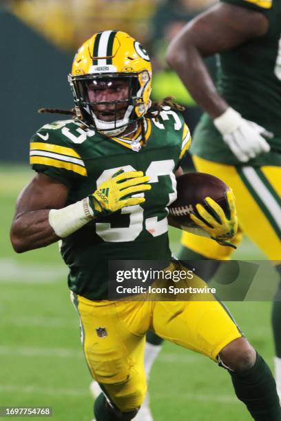 Green Bay Packers running back Aaron Jones runs with the ball during a game between the Green Bay Packers and the Detroit Lions on September 28, 2023...