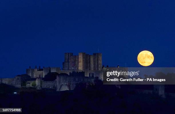 Supermoon is visible above Dover Castle in Kent. The moon will be near its closest approach to the Earth and may look slightly larger and brighter...