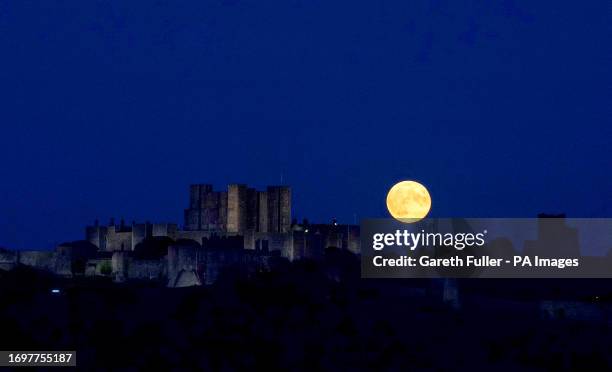 Supermoon is visible above Dover Castle in Kent. The moon will be near its closest approach to the Earth and may look slightly larger and brighter...