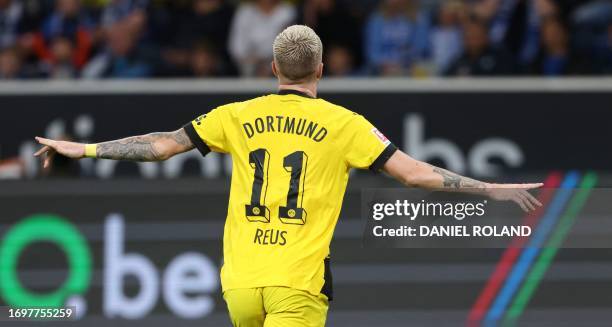 Dortmund's German forward Marco Reus celebrates scoring the 1-2 goal during the German first division Bundesliga football match TSG 1899 Hoffenheim v...