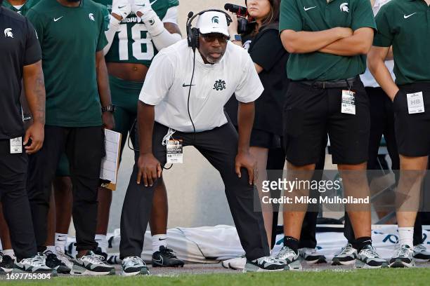 Acting head coach Harlon Barnett of the Michigan State Spartans looks on in the fourth quarter of a game against the Maryland Terrapins at Spartan...
