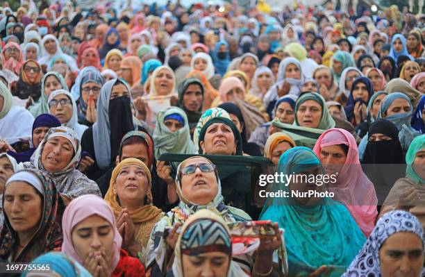 Kashmiri women pray on the occasion of celebration of Mawlid al-Nabawi or Prophet Muhammad's birth anniversary in Dargah Hazratbal shrine in...