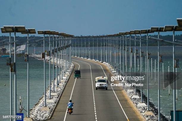 Vehicles move on the Sangupiddy Bridge in Jaffna, Sri Lanka, on September 29, 2023. Sangupiddy Bridge is a road bridge across Jaffna Lagoon in...