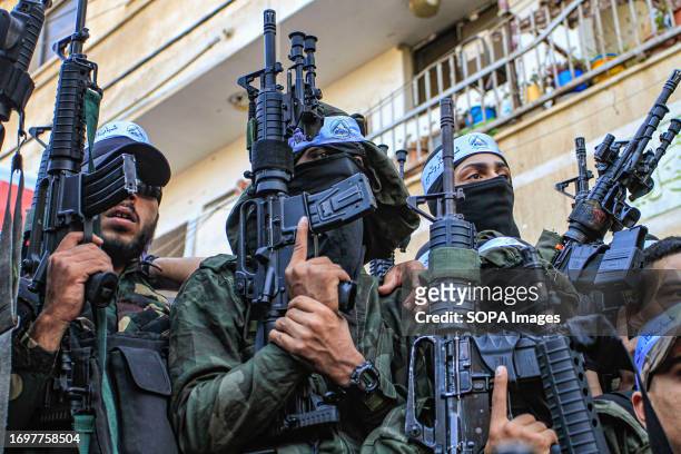 Palestinian masked gunmen from the Balata Brigade seen during a military parade in the Balata refugee camp near Nablus in the occupied West Bank.