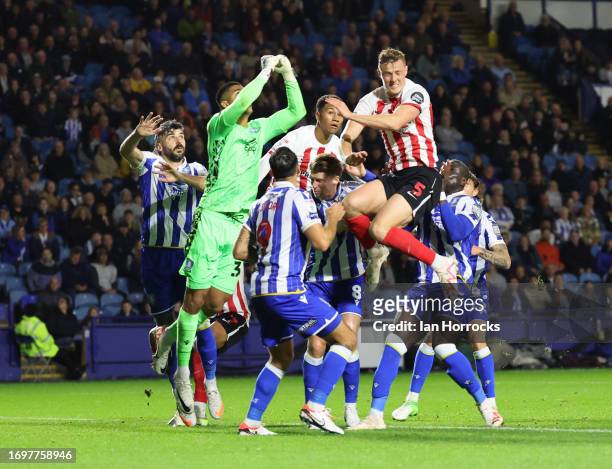 Dan Ballard of Sunderland goes up with Sheffield keeper Devis Vasquez during the Sky Bet Championship match between Sheffield Wednesday and...