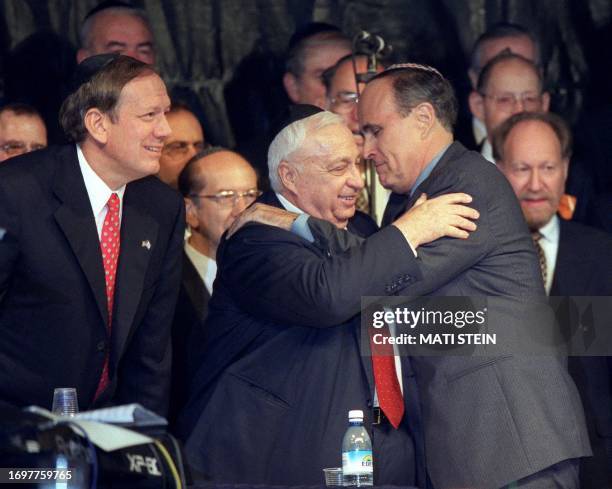 New York Governor George Pataki, Israeli Prime Minister Ariel Sharon and New York Mayor Rudolph Giuliani, arrive for a candle-light ceremony on the...