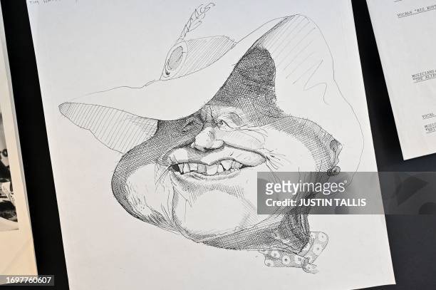 Sketch of the puppet depicting Britain's late Queen Elizabeth, the Queen Mother, is pictured during a press preview for the exhibition 'Spitting...