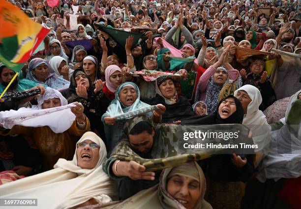 Muslims devotees pray as the head priest displays the holy relic of the Prophet Muhammed on Eid-e-Milad-u-Nabi, the birthday of the Prophet Muhammad,...