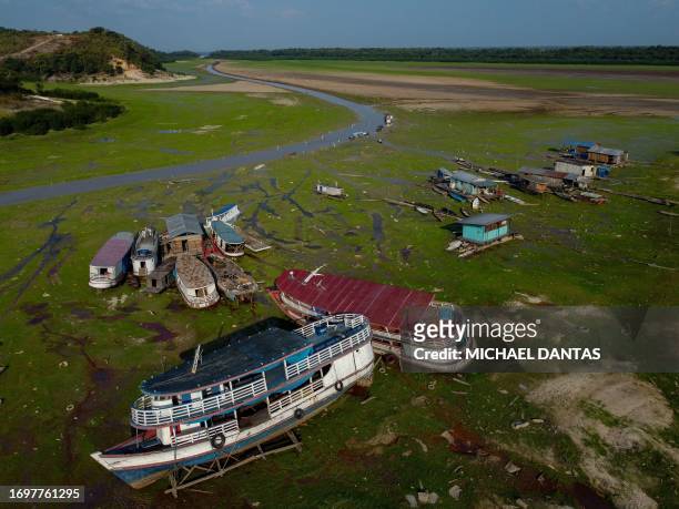 In this aerial view, boats are seen stranded in Aleixo Lake due to the severe drought west of Manaus, Amazonas State, on September 29, 2023. Manaus...