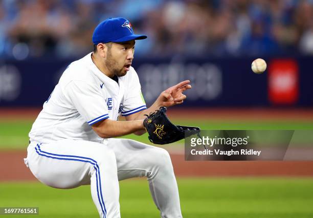 Yusei Kikuchi of the Toronto Blue Jays fields a ground ball in the first inning against the Tampa Bay Rays at Rogers Centre on September 29, 2023 in...